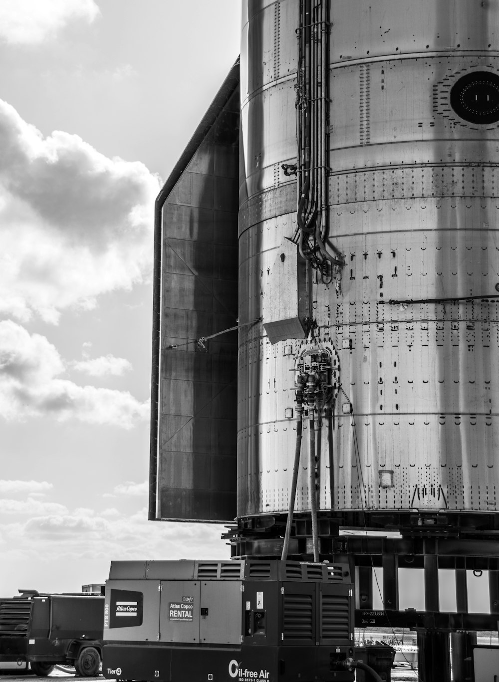 a black and white photo of a large tank