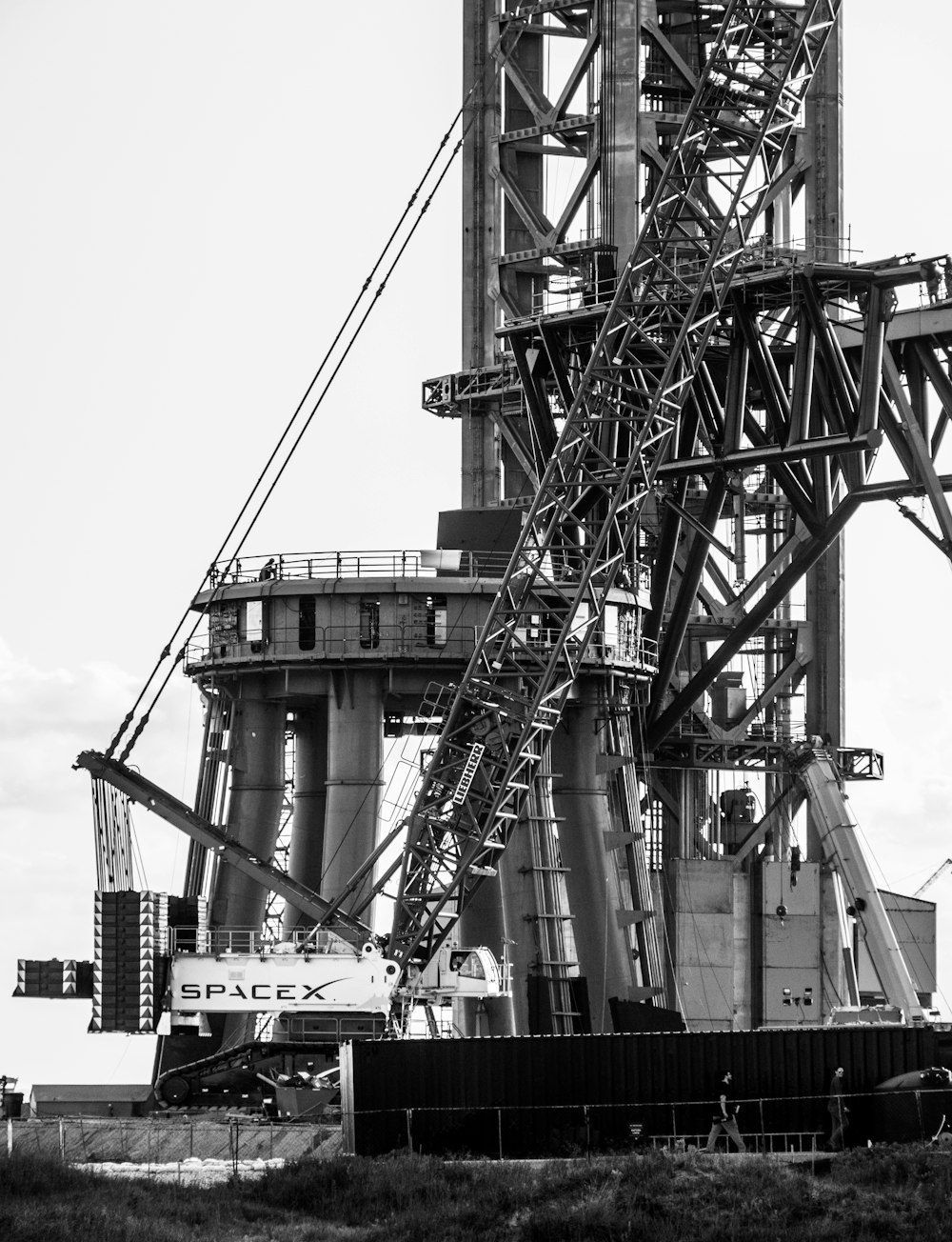 a black and white photo of a large crane