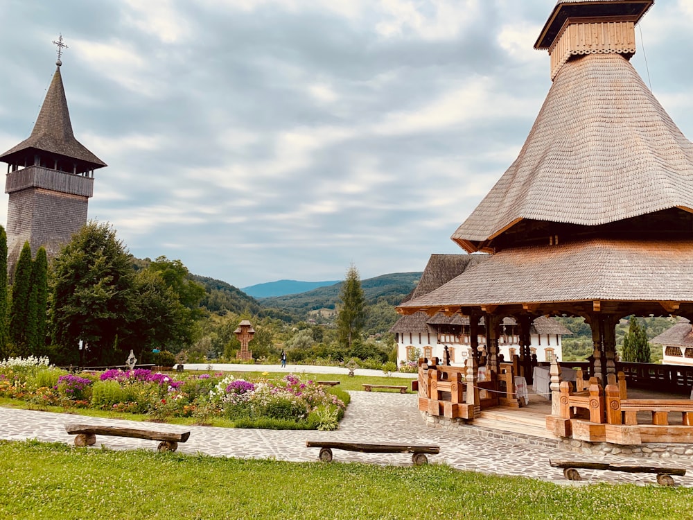 a gazebo in a park with benches around it