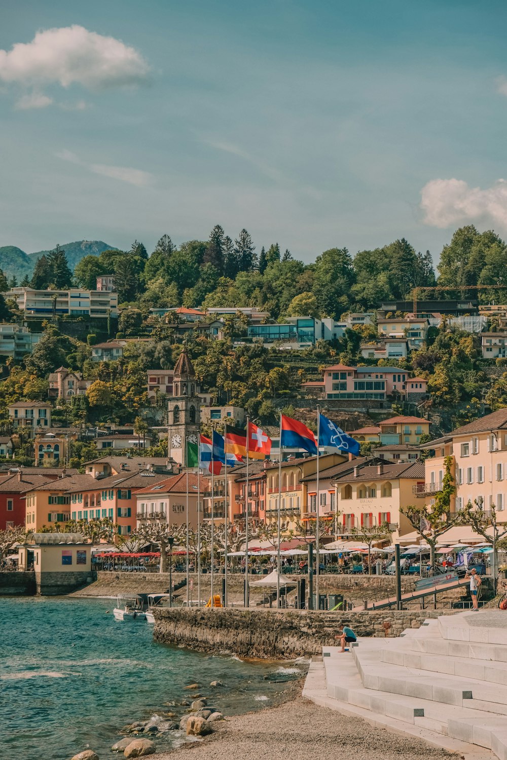 a small town with a harbor and a mountain in the background