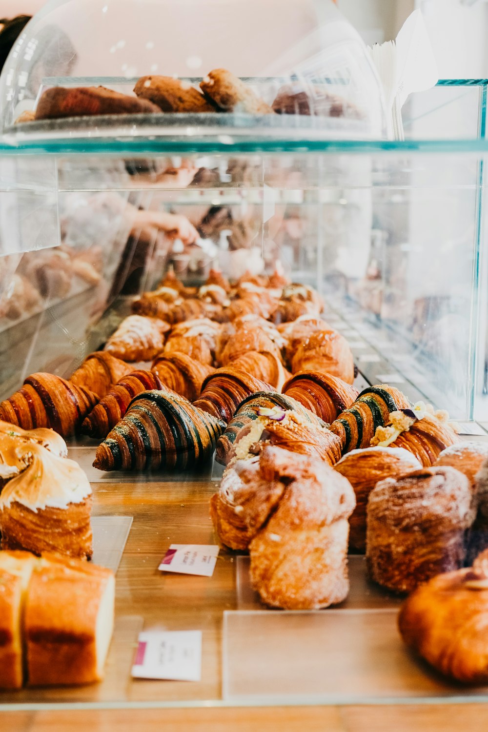 a display case filled with lots of different types of pastries