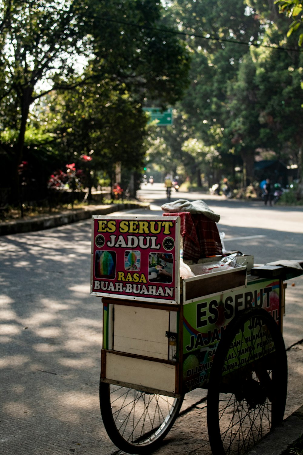 a street vendor cart sitting on the side of the road