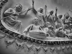 a black and white photo of a group of statues