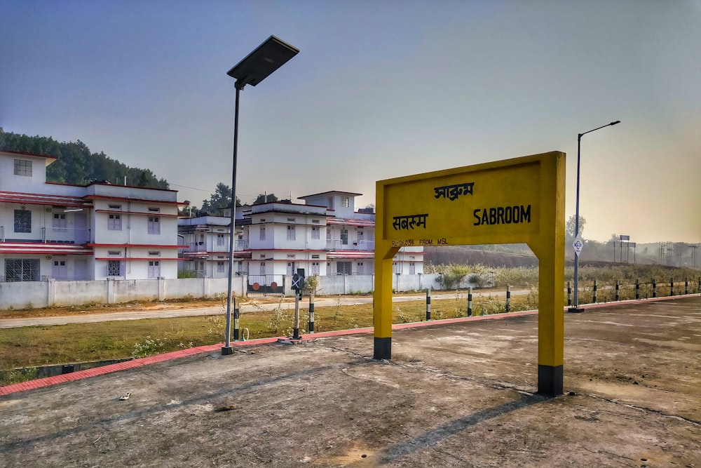 a yellow sign sitting on the side of a road