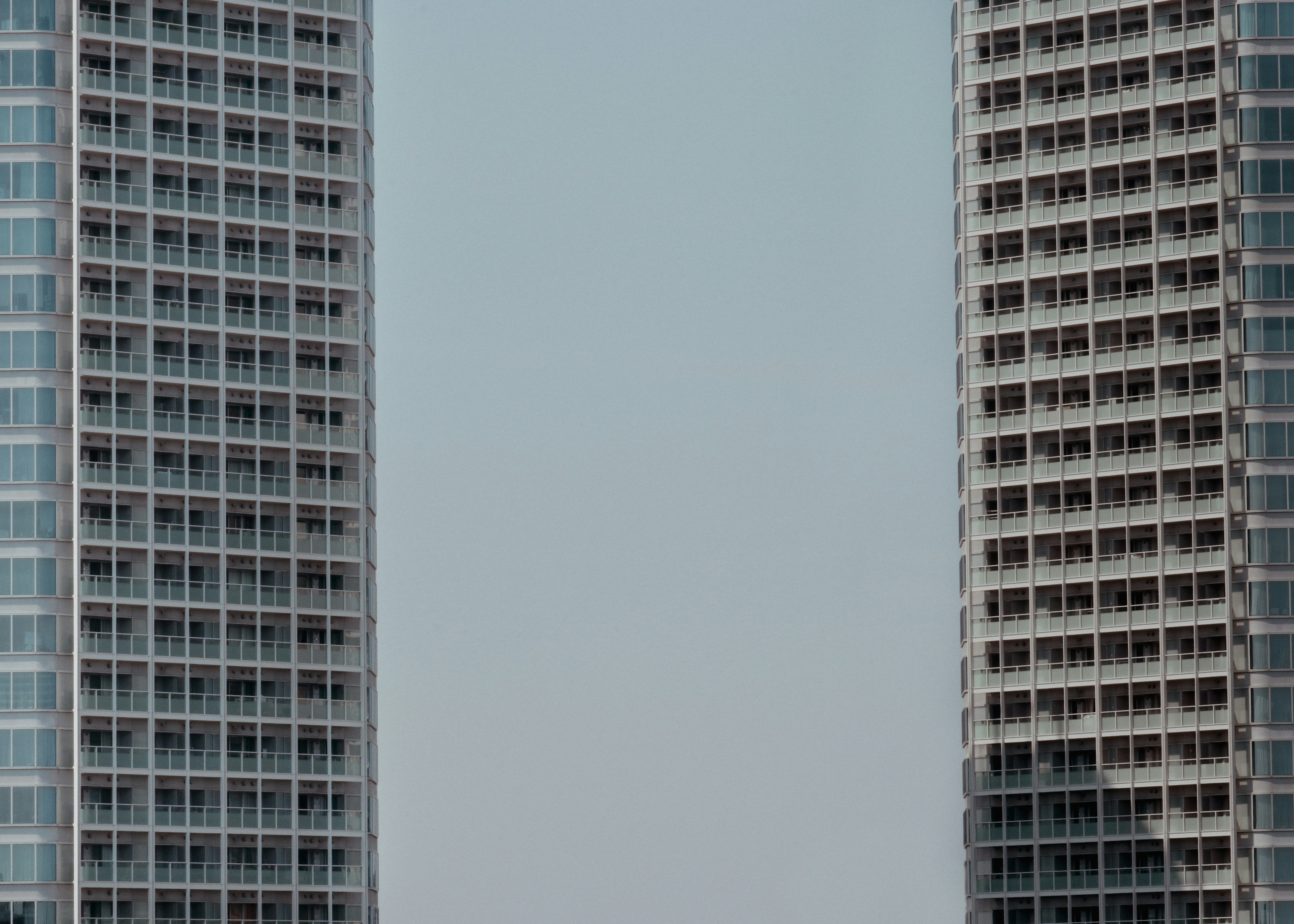 a couple of tall buildings sitting next to each other