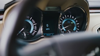 a car dashboard with a speedometer and other gauges