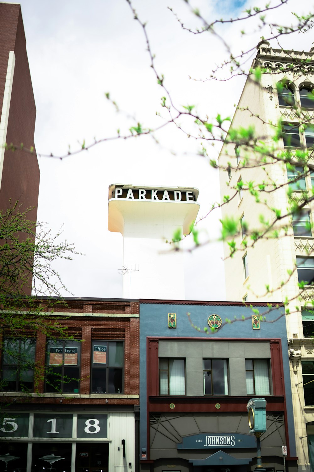 a building with a parking sign on top of it