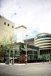 a large building with a clock tower in the background