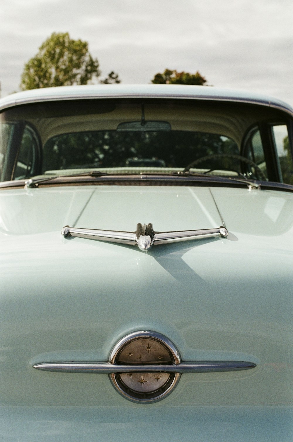 a close up of the front of a classic car