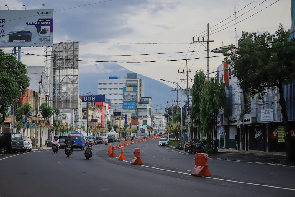 a city street with traffic cones on both sides