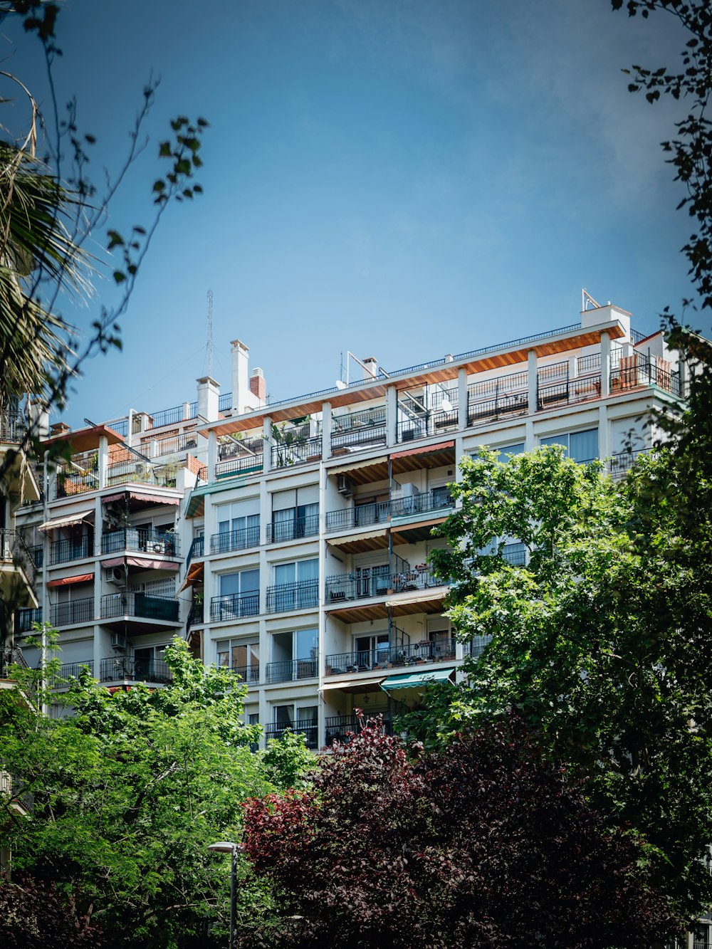 a tall building with balconies and balconies on top of it