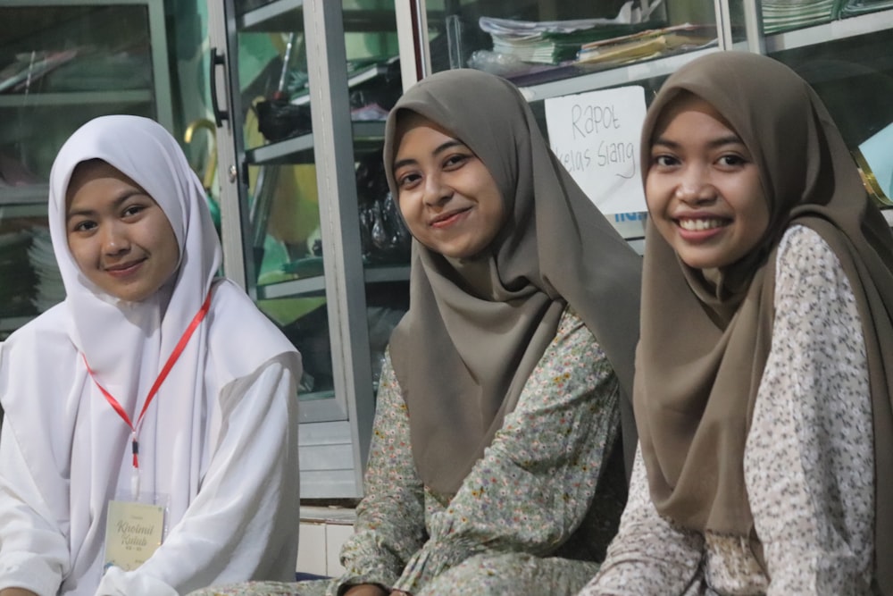 a group of young women sitting next to each other