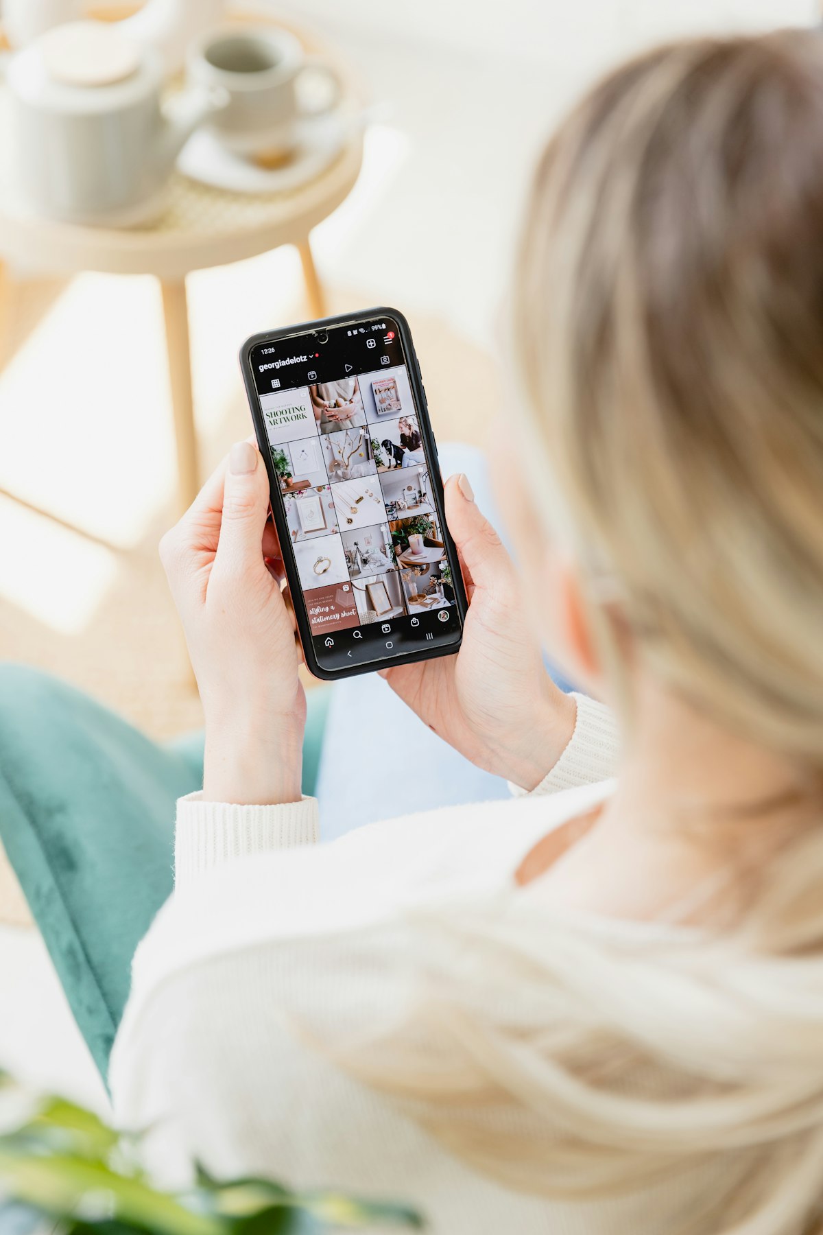 Close-up of Instagram notifications and engagement metrics on a phone screen illustrating algorithm-driven content distribution