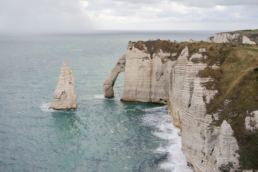 two large rocks sticking out of the ocean