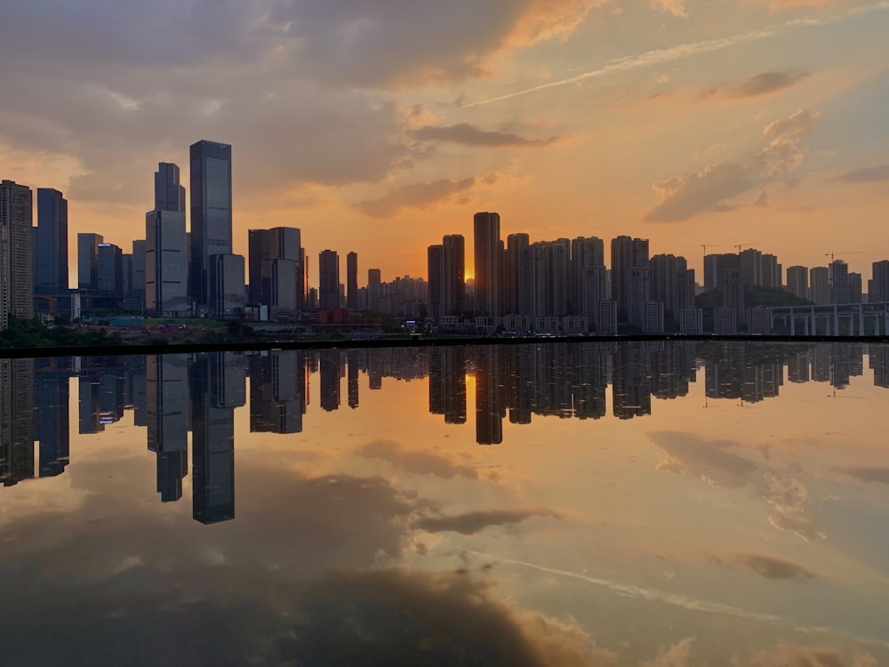 a large body of water with a city in the background