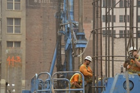 a couple of men standing next to each other