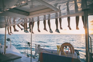 a bunch of shoes hanging from a line on a boat