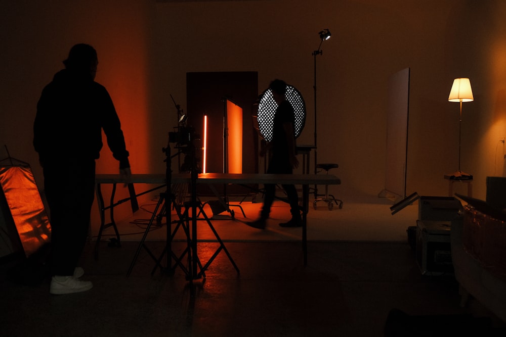 a man standing in a dimly lit room