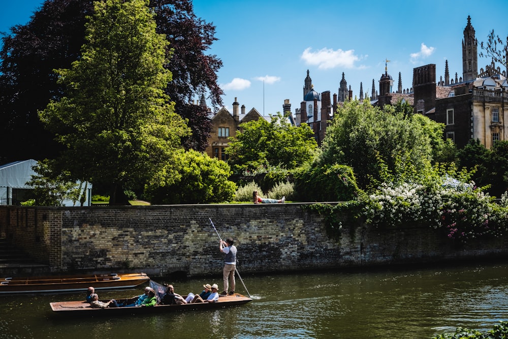 a group of people riding on top of a boat on a river