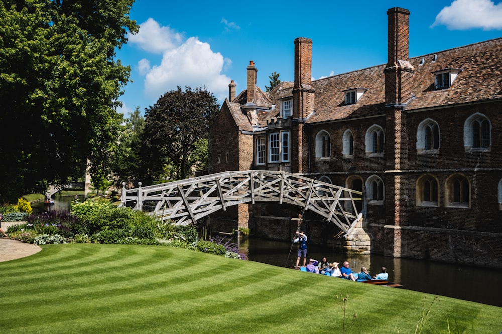 a bridge over a body of water in front of a building