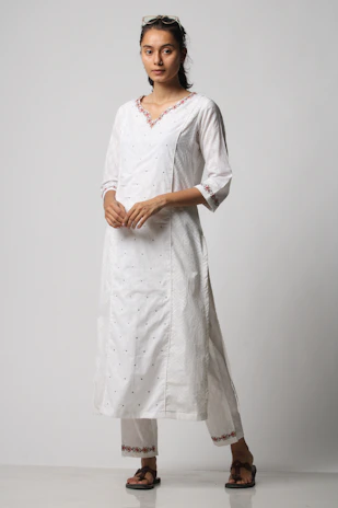 Models wearing casual kurtas and jeans, blending South Asian style with Swedish streetwear.
