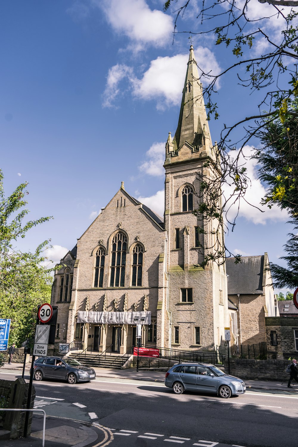 a church with a tall steeple and a clock tower