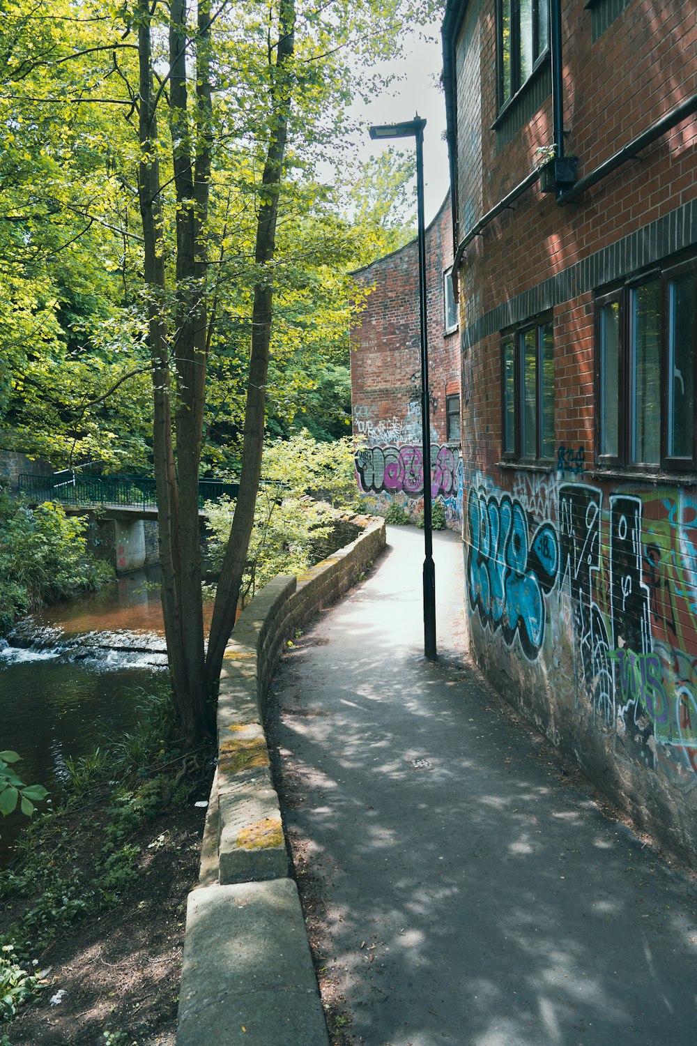 a brick building with graffiti on the side of it