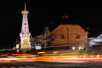 Close-up of the Tugu Petir monument bathed in warm sunlight, symbolizing the spirit of unity.