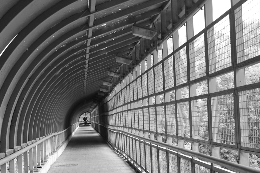 a black and white photo of a walkway