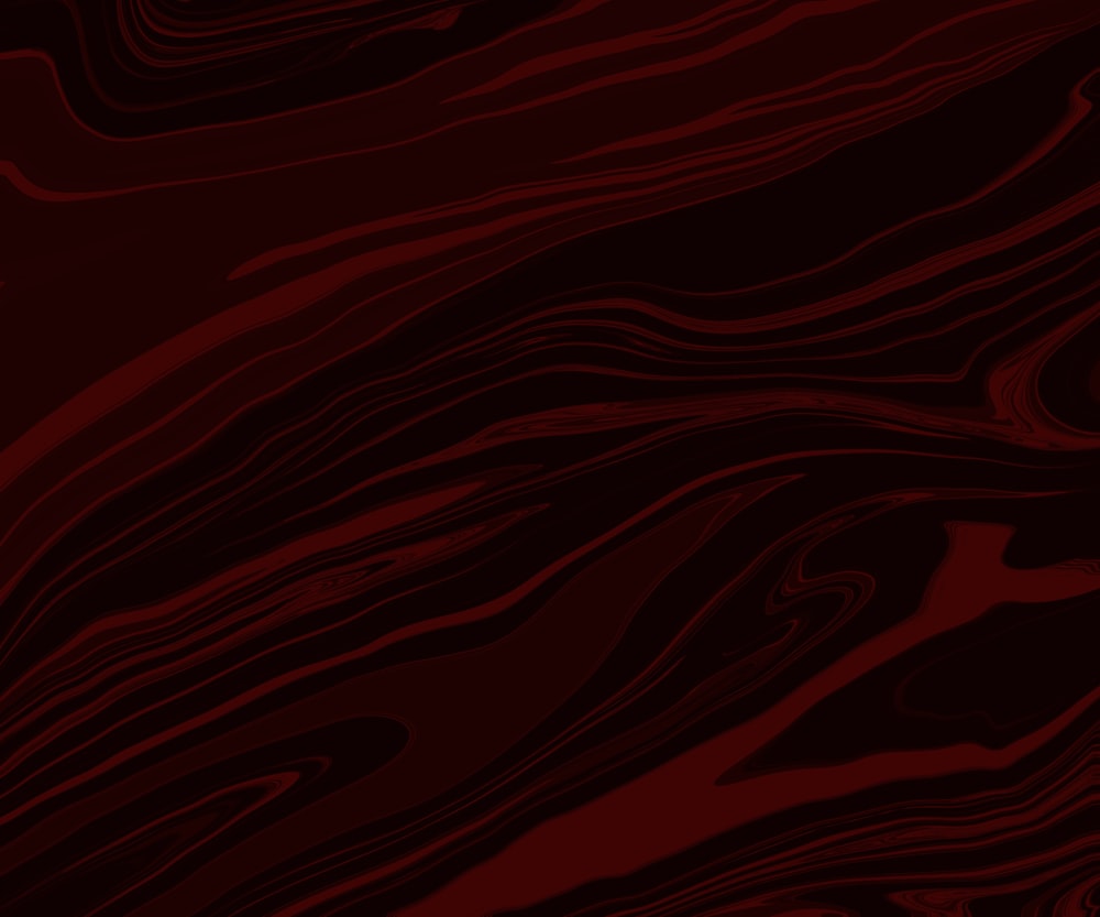 um fundo abstrato vermelho e preto com linhas onduladas