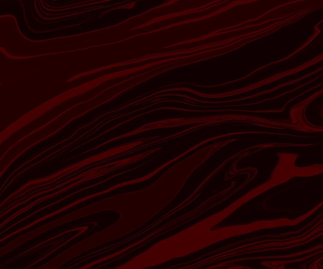a red and black abstract background with wavy lines,