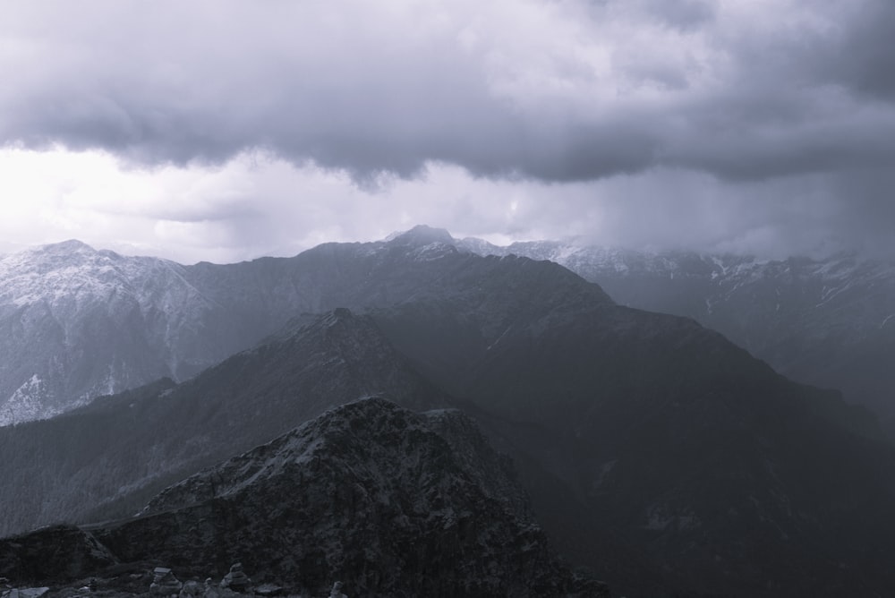 a black and white photo of a mountain range