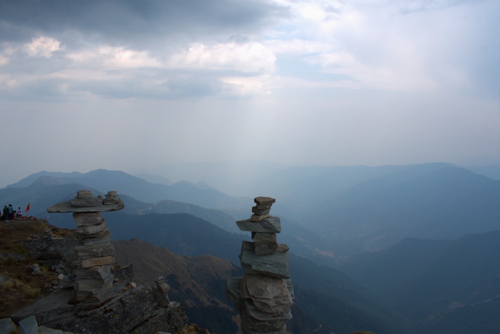 a stack of rocks on top of a mountain