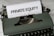 A vintage green typewriter with a sheet of paper inserted displays the text 'PRIVATE EQUITY' in bold letters. The typewriter rests on a white marble surface, and its keys and mechanisms are visible.