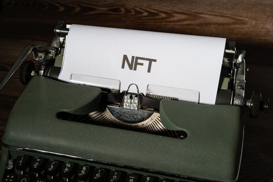 Typewriter with the acronym NFT on a piece of paper
