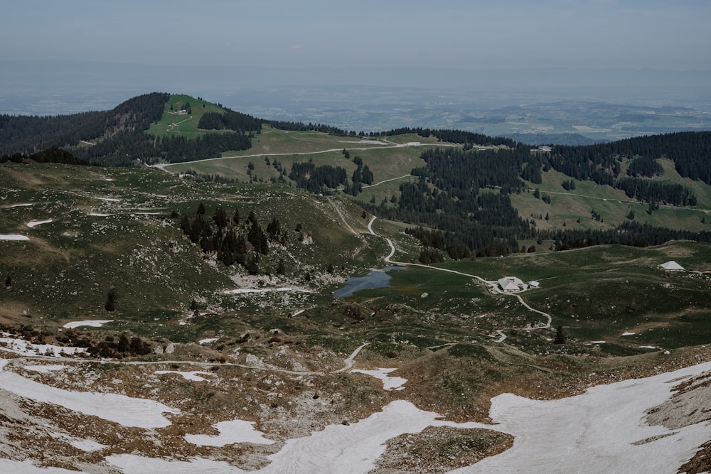 a view of a mountain with a lake in the middle of it