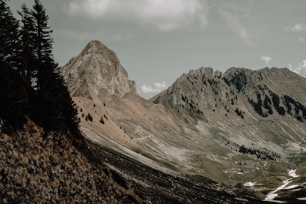 a mountain range with snow on the ground