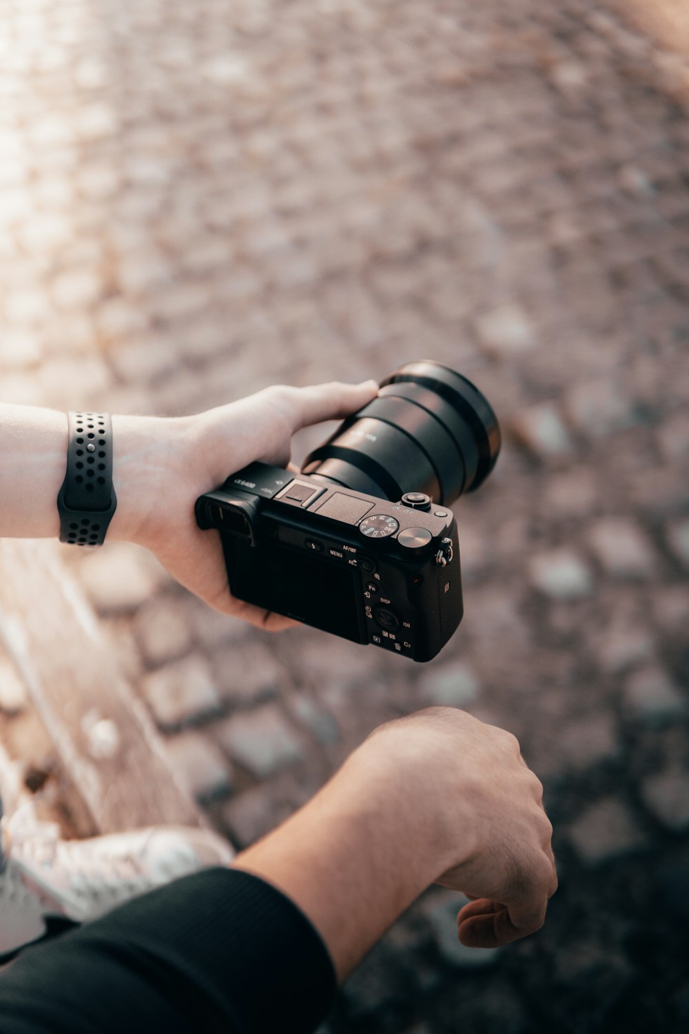 a person holding a camera in their hand