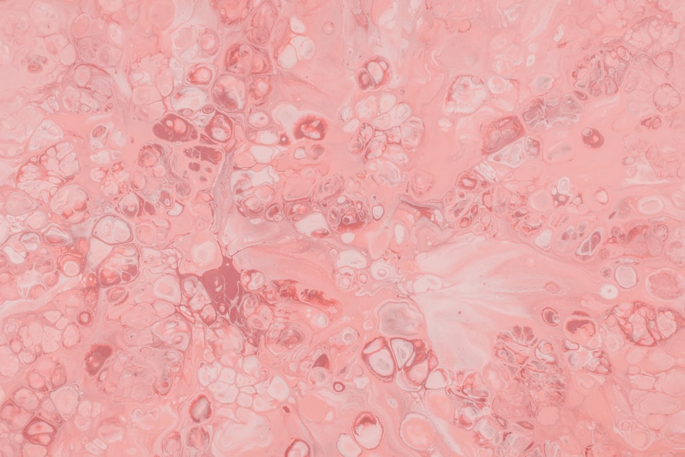 Un fond rose avec beaucoup de bulles et de bulles