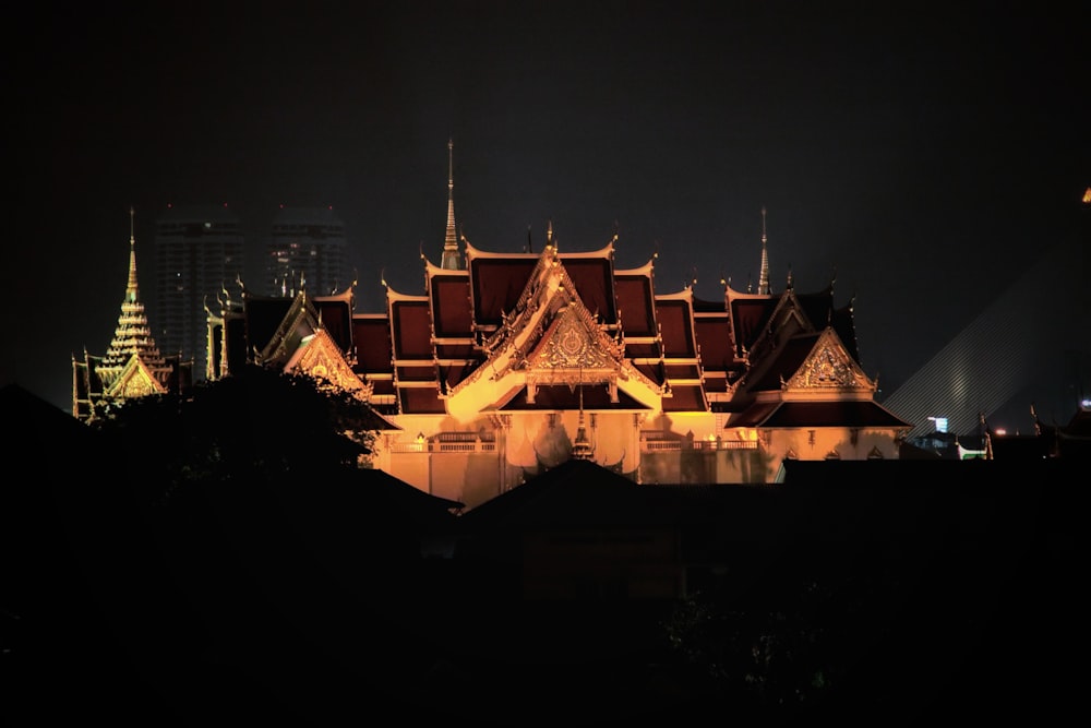 a large building with many spires lit up at night