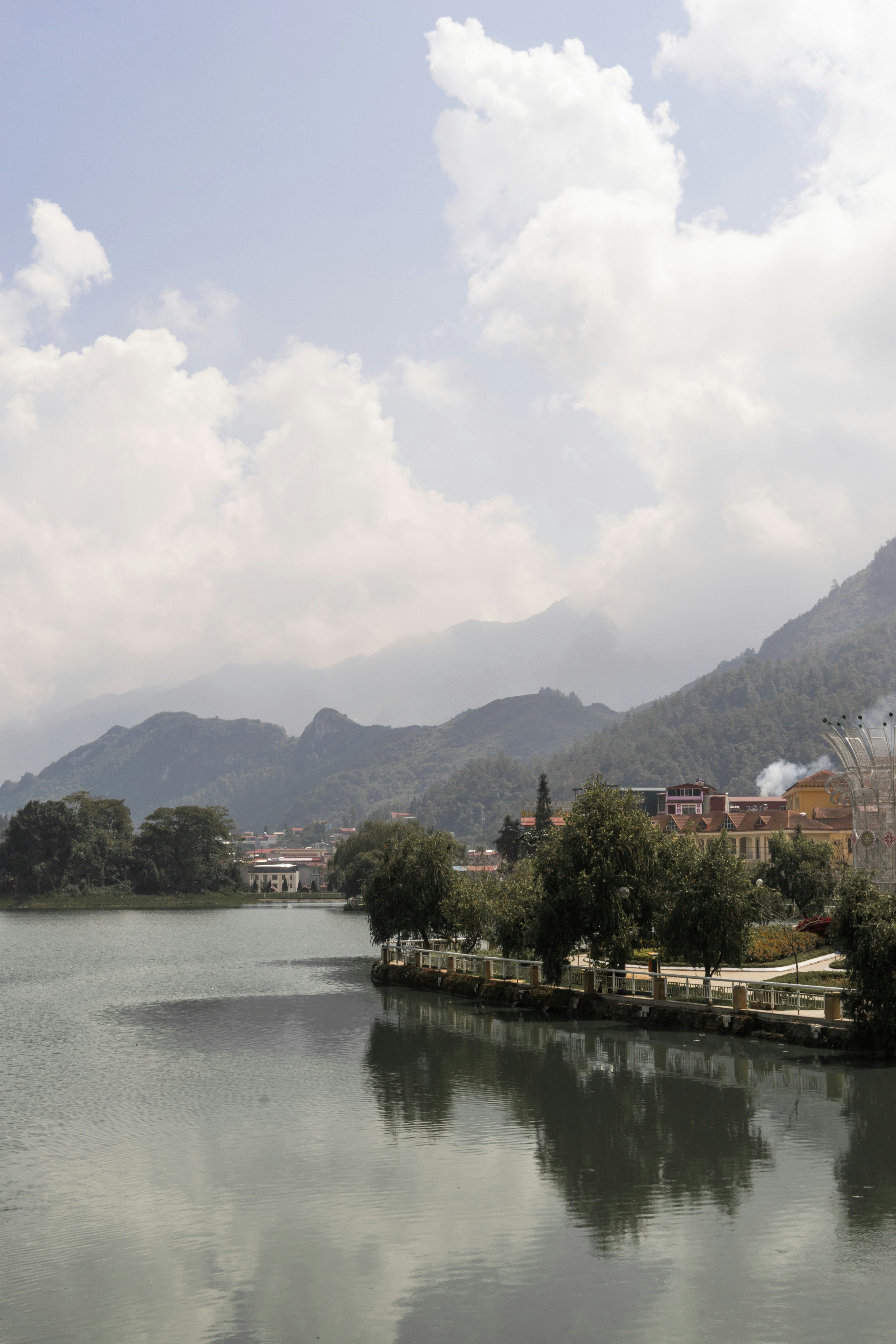 a body of water surrounded by mountains and trees
