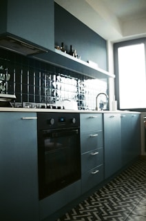 a kitchen with a stove and a sink