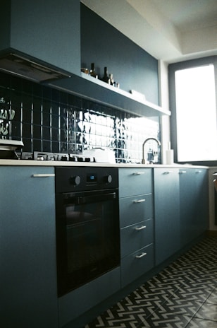 a kitchen with a stove and a sink