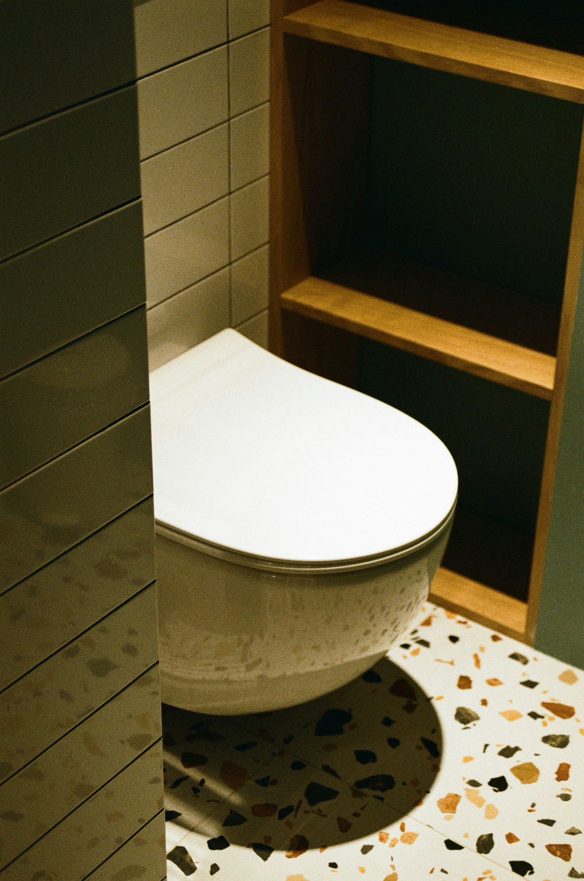 Modern comfort toilet with customer service representative.