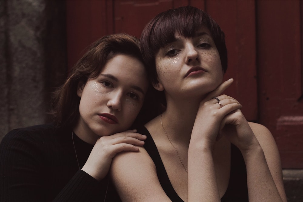 a couple of women sitting next to each other