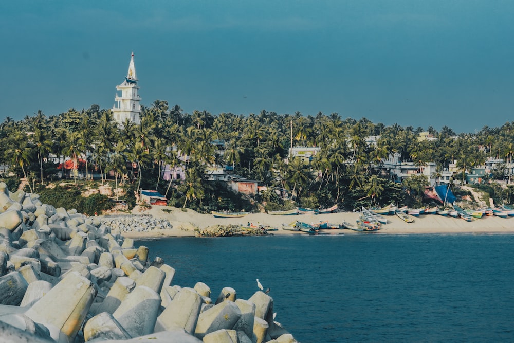 a view of a beach with a church in the background