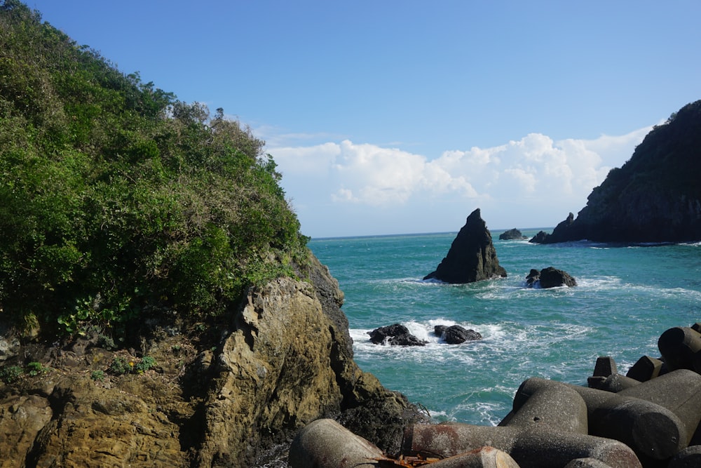 a view of the ocean from a rocky shore