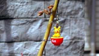 Close-up of a colorful Pikachu collectible ball with vibrant details.