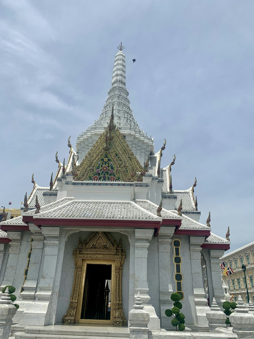 a large white building with a gold door