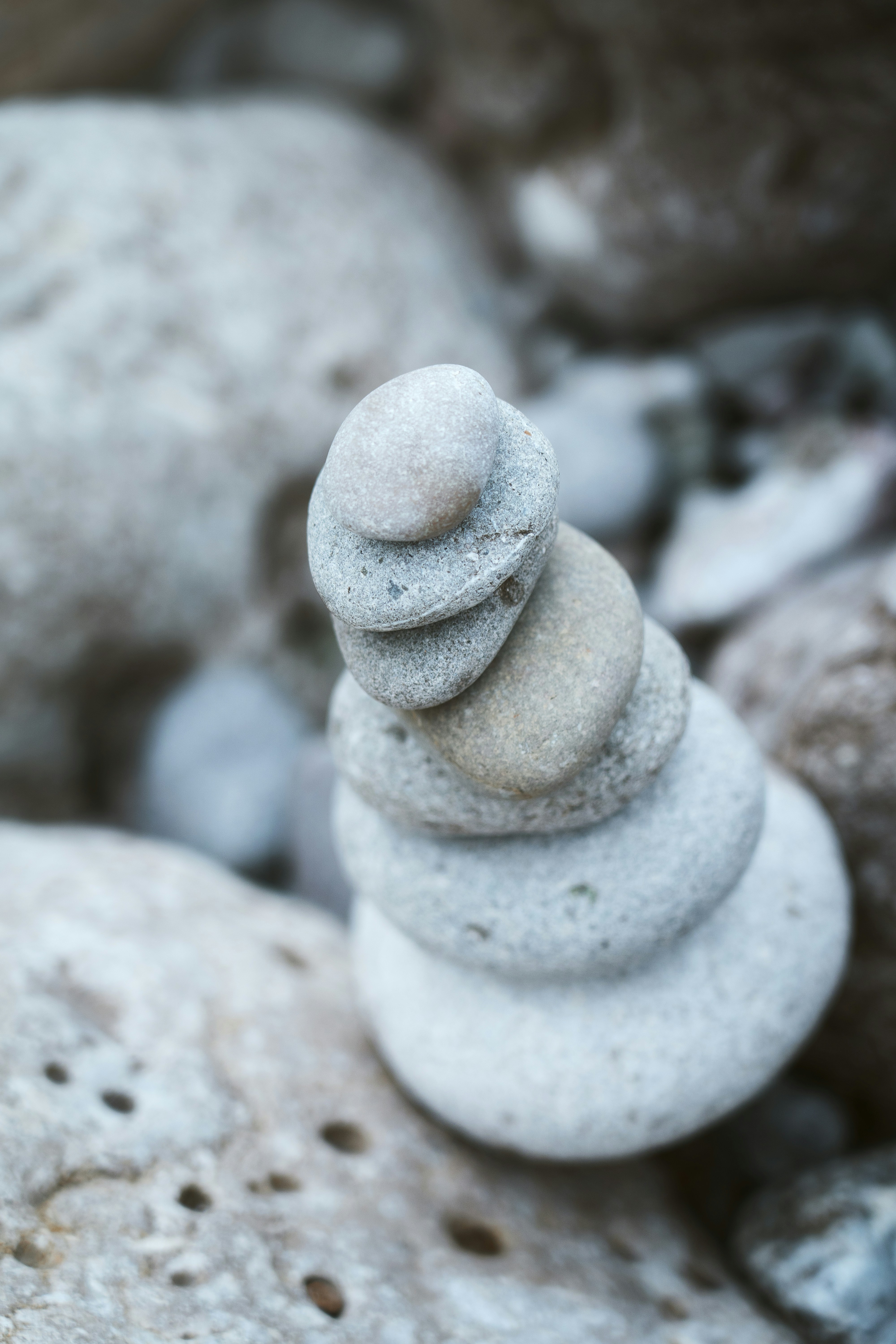 a stack of rocks sitting on top of a pile of rocks